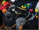  ??  ?? Myanmar climber Aung Khaing Myint preparing gear for rock climbing training at a gym in Yangon.