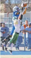  ?? SHEILA MILLER FOR THE NEW MEXICAN ?? Dexter wide receiver Sergio Ramirez catches a 17-yard touchdown pass over West Las Vegas cornerback Devin Tenorio late in the first half of a Class 3A semifinal at Demon Field on Saturday. The Demons beat West Las Vegas 35-7 to advance to the 3A title game against Las Vegas Robertson.