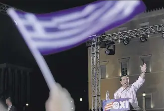  ?? PETROS KARADJIAS/ASSOCIATED PRESS ?? Greece’s Prime Minister Alexis Tsipras delivers a speech during a rally organized by supporters of the “no” vote in Athens on Friday. A new opinion poll shows a dead heat in Greece’s referendum campaign less than two days before Sunday’s vote on...