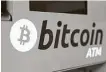  ?? Kin Cheung / Associated Press ?? Bitcoin rose to $43,863 after Tesla’s announceme­nt. Prices in the digital currency have had wild swings since 2017.