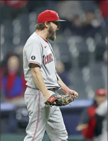  ?? Tribune News Service ?? Cincinnati Reds starting pitcher Wade Miley reacts after pitching a no-hitter against
the Cleveland Indians on May 7 at Progessive Field in Cleveland.