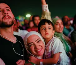  ?? — AFP ?? People attend the Fifa Fan Festival opening day at Al Bidda park in Doha on Saturday, ahead of the Qatar 2022 World Cup football tournament.