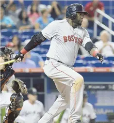  ?? AP PHOTO ?? BRIGHT SPOT: David Ortiz delivered a single in addition to his two home runs in the Red Sox’ 14-6 loss to the Marlins yesterday in Miami.