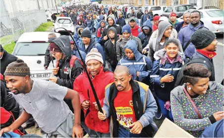  ?? PICTURE: HENK KRUGER/AFRICAN NEWS AGENCY/ANA ?? PROTESTING: Workers affiliated to Numsa march down Neptune Street in Paarden Eiland.