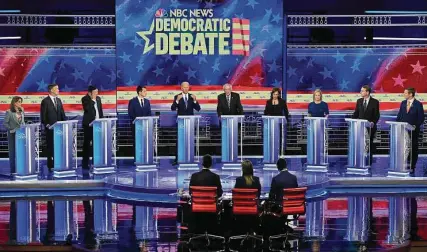  ?? Saul Loeb / AFP/Getty Images ?? Author Marianne Williamson, from left; former Colorado Gov. John Hickenloop­er; tech entreprene­ur Andrew Yang; South Bend, Ind., Mayor Pete Buttigieg; former Vice President Joe Biden; Vermont Sen. Bernie Sanders; California Sen. Kamala Harris; New York Sen. Kirsten Gillibrand; Colorado Sen. Michael Bennet; and Colorado Rep. Eric Smalwell.