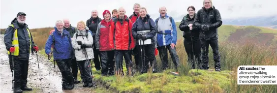  ??  ?? All smilesThe alternate walking group enjoy a break in the inclement weather