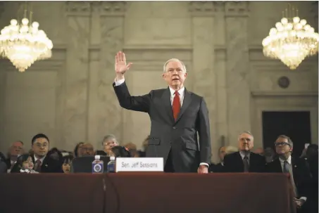  ?? Chip Somodevill­a / Getty Images ?? Sen. Jeff Sessions, R-Ala., is sworn in at the start of his confirmati­on hearing to be the U.S. attorney general.