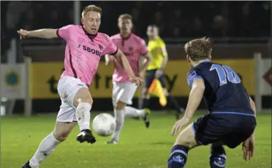  ??  ?? Chris Kenny of Wexford Youths controls the ball as Gareth McCaffrey (Drogheda United) looks on.