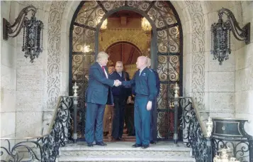  ?? — AFP ?? US President-elect Donald Trump with military leadership following meetings at Mar-a-Lago in Palm Beach, Florida, on Wednesday.