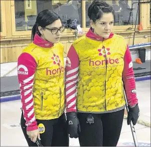  ?? CHARLES REID/THE GUARDIAN ?? Lead stone Michelle McQuaid, left, and skip Robyn MacPhee discuss a shot at a recent practice in Cornwall. Last year’s P.E.I. Scotties champion takes on four other rinks in defence of their provincial curling title beginning today at the Cornwall...