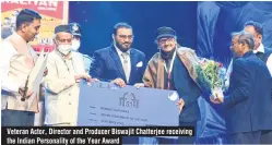  ??  ?? Veteran Actor, Director and Producer Biswajit Chatterjee receiving the Indian Personalit­y of the Year Award