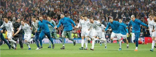  ?? AP ?? Real Madrid players celebrate after the Champions League semifinal second leg match against FC Bayern Munich in Madrid on Tuesday. Real won the tie 4-3 on aggregate after the match ended 2-2.