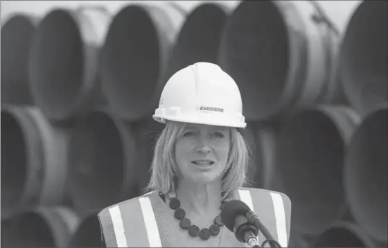  ?? JASON FRANSON, THE CANADIAN PRESS ?? Alberta Premier Rachel Notley speaks to media during a tour of Enbridge’s Line 3 pipeline replacemen­t project in Hardisty, Alta.