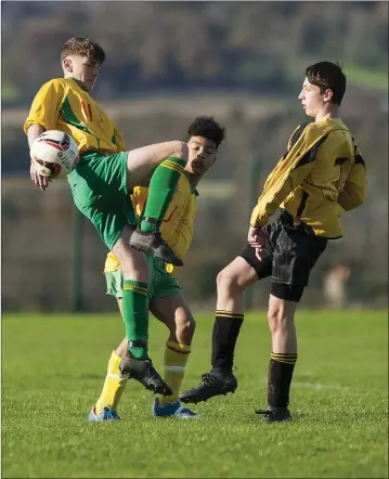  ??  ?? Rathnew’s Ross Quinn and Avonmore’s Keelan Busher compete for the ball during the under-16 WDSL clash in Shamrock Park, Rathnew. Picture: Garry O’Neill