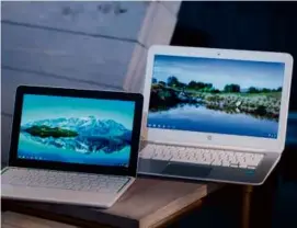  ?? MARK LENNIHAN/ASSOCIATED PRESS/FILE 2013 ?? HP Chromebook 11 (left) with a Chromebook 14 in 2013. Activists want operating system updates for 10 years.