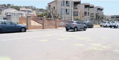  ??  ?? PAINTED rings mark the spots where bullet casings fell during a gun battle between off-duty SANDF and SAPS officers in Durban at the weekend.