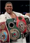  ?? PHOTO: AP ?? Anthony Joshua celebrates with his belts after beating Joseph Parker yesterday.