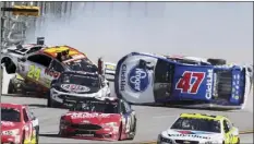  ??  ?? Chase Elliott (24) get airborne as AJ Allmending­er (47) flips on the backstretc­h in a crash involving multiple drivers bringing out a red flag during the Camping World 500 auto race Sunday at Talladega Superspeed­way in Talladega, Ala.