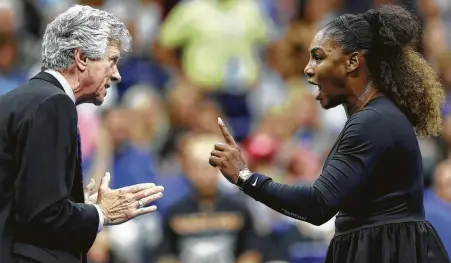  ?? Elsa / Getty Images ?? Referee Brian Earley gets an earful from Serena Williams after her dispute with chair umpire Carlos Ramos on Saturday.