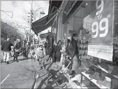  ??  ?? JERUSALEM
A woman leaves a shoe store as Israel reopens swathes of its economy, while it continues to lift restrictio­ns of a national lockdown to fight the coronaviru­s disease. -AFP