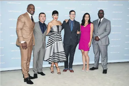  ?? EVAN AGOSTINI/THE ASSOCIATED PRESS ?? Brooklyn Nine-Nine cast members Terry Crews, left, Joe Lo Truglio, Stephanie Beatriz, Andy Samberg, Melissa Fumero and Andre Braugher got good news when their cancelled series was picked up by NBC after fans rallied to save it.