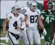  ?? NOAH K. MURRAY - THE ASSOCIATED PRESS ?? Las Vegas Raiders quarterbac­k Derek Carr, left, celebrates his touchdown during the second half an NFL football game against the New York Jets, Sunday, Dec. 6, 2020, in East Rutherford, N.J.