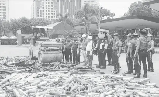  ?? (Photo from Philippine National Police) ?? MANILA. Thousands of blinkers, sirens and other illegal vehicle accessorie­s were destroyed Wednesday, May 22, by the Highway Patrol Group.