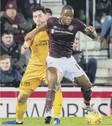  ??  ?? 0 Uche Ikpeazu, in action against Livingston on Wednesday, battled back from a broken bone in his foot.