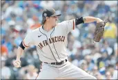  ??  ?? Giants starting pitcher Kevin Gausman delivers against the Cubs during the first inning on Saturday in Chicago.