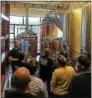  ?? SUBMITTED PHOTO ?? Iron Hill Brewery & Restaurant Head Brewer Will Mink, far left, gives a tour of the Phoenixvil­le location’s brewing process to members of Kimberton Fire Company.