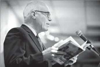  ?? Herald photo by Tijana Martin ?? Kevin Taft reads from his book during his SACPA presentati­on “Oil's Deep State: Does the Petroleum Industry Undermine Democracy?” at Country Kitchen Catering on Thursday. @TMartinHer­ald