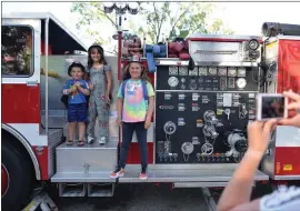  ?? File photo ?? A Bishop Volunteer Fire Department engine was popular with kids for having their photo taken during the 2021 National Night Out.