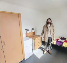  ??  ?? Melanie Ransome of Aryze Developmen­ts in the showroom during a tour of the Tiny Homes Village next to Royal Athletic Park. Each resident will have their own unit with a bed, chair, wardrobe, dresser and small fridge.