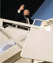  ??  ?? NO REPEAT: Biden waves after climbing the stairs Friday night at Dobbins Reserve Air Base in Marietta, Ga., for the return flight to Andrews.