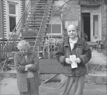  ?? GRAHAM HUGHES THE GAZETTE ?? John Panagiotop­oulos, 54, and his mother, Cristina, 79, during their eviction on Thursday.