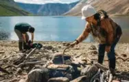  ??  ?? Labrador Inuit elder Sophie Keelan preparing bannock on the shore of the Saglek Fjord.