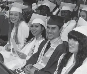  ?? Joseph B. Nadeau/The Call ?? From left, Woonsocket High School seniors Amber Smith, Alexis Sikhao, Lucas Rodriguez and Kiara Poirier share a laugh during the school’s awards ceremonies.