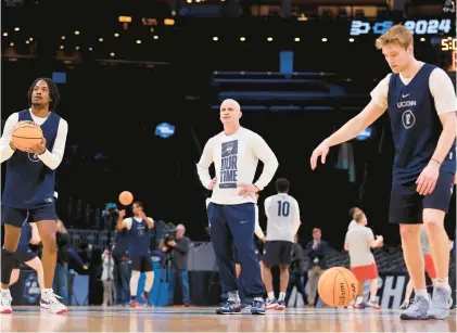  ?? MICHAEL REAVES/GETTY ?? Uconn head coach Dan Hurley looks on during practice for today’s NCAA Tournament Sweet 16 game against San Diego State on Wednesday at TD Garden in Boston. The Huskies have won eight straight NCAA tourney games by double digits dating to last year.