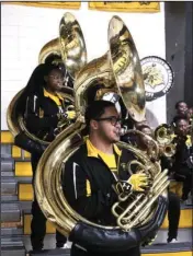  ?? The Sentinel-Record/Richard Rasmussen ?? NATIONAL FLAVOR: University of Arkansas at Pine Bluff marching band members Taylor Alderson, left, and Caleb Patterson were among students to perform Wednesday at Trojan Fieldhouse for juniors and seniors at Hot Springs World Class High School. John...