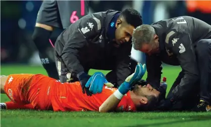  ??  ?? Kiko Casilla of Leeds United receives treatment from club doctors including Rishi Dhand (left) during the Championsh­ip match against West Brom. Photograph: Malcolm Couzens/Getty Images