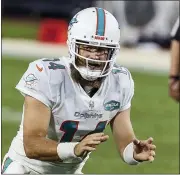  ?? ASSOCIATED PRESS FILE PHOTO ?? Miami Dolphins quarterbac­k Ryan Fitzpatric­k (14) waits for the snap during the second half of game against the Jacksonvil­le Jaguars last year in Jacksonvil­le, Fla.