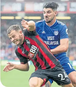  ??  ?? Ryan Fraser and Callum Paterson clash during a recent meeting of Bournemout­h and Cardiff City