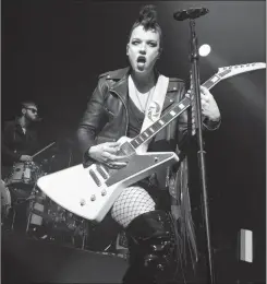  ??  ?? Lzzy Hale, lead vocalist and guitarist of Halestorm, wowed the crowd with her extraordin­ary talents.