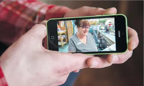  ?? GERRY KAHRMANN ?? Andrew Grimeau displays a photo of his adoptive mother, Mary Louise Murphy, who died earlier this month after she was discharged from the emergency room at Abbotsford Regional Hospital. “Once she had spoken to the doctor, they didn’t feel any need to...