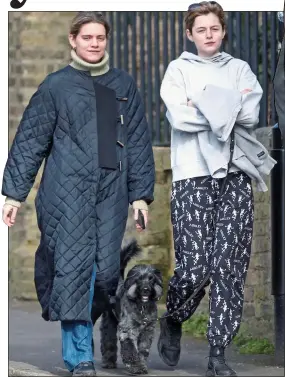  ??  ?? WALKIES: Emma Corrin with her dog – aptly called Spencer – and flatmate