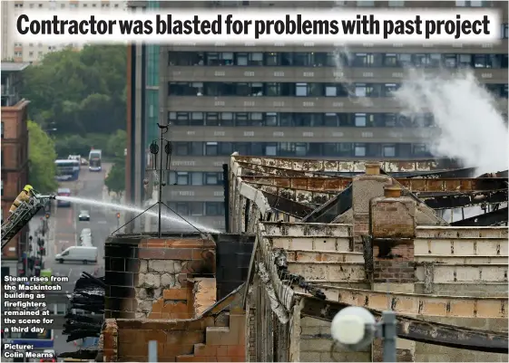  ?? Picture: Colin Mearns ?? Steam rises from the Mackintosh building as firefighte­rs remained at the scene for a third day