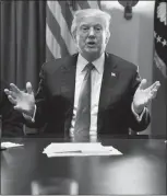  ?? EVAN VUCCI / AP ?? President Donald Trump gestures during a meeting with lawmakers on immigratio­n policy Tuesday in the Cabinet Room of the White House.