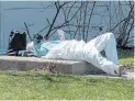  ?? THE CANADIAN PRESS FILE PHOTO ?? A health-care worker takes a break at a mobile COVID-19 testing clinic in Montreal. Loneliness and isolation are taking an increasing toll, writes Arjun Sharma.