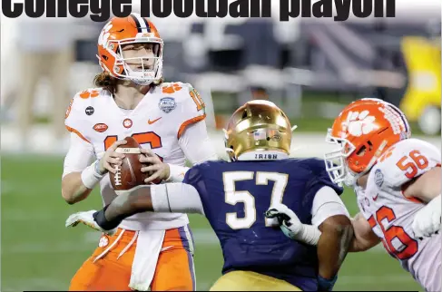  ?? Jared C. Tilton / Getty Images /TNS ?? Clemson quarterbac­ktrevor Lawrence (16) looks to pass in the fourth quarter against Notre Dame during the ACC Championsh­ip game at Bank of America Stadium in Charlotte, North Carolina, on Saturday. Clemson won, 34-10.