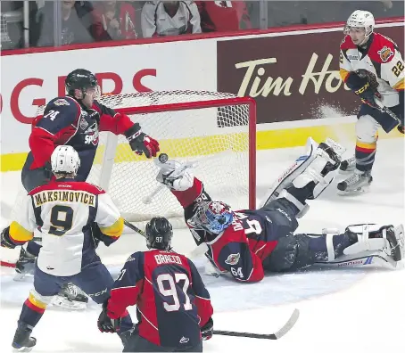  ?? JASON KRYK ?? Windsor Spitfires goaltender Michael DiPietro makes a sprawling save during Sunday’s Memorial Cup final Sunday night at WFCU Centre in Windsor. DiPietro was a standout in the Spitfires’ 4-3 victory.